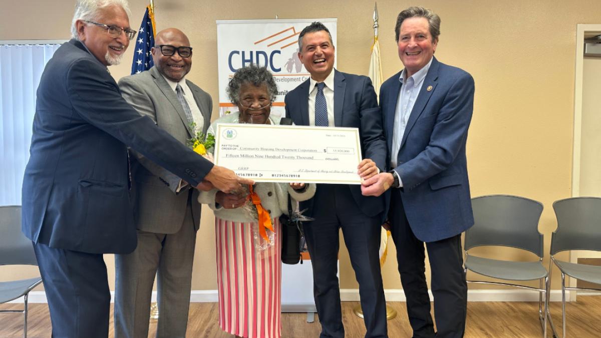 Congressman John Garamendi presenting the check with Richmond Mayor Eduardo Martinez, Community Housing Development Corporation Executive Director Donald Gilmore, the longest-tenured Pullman Point resident Ms. Linda Daniels, and HUD's Honorable Adrianne Todman. 