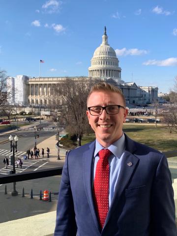 Person in front of Capitol