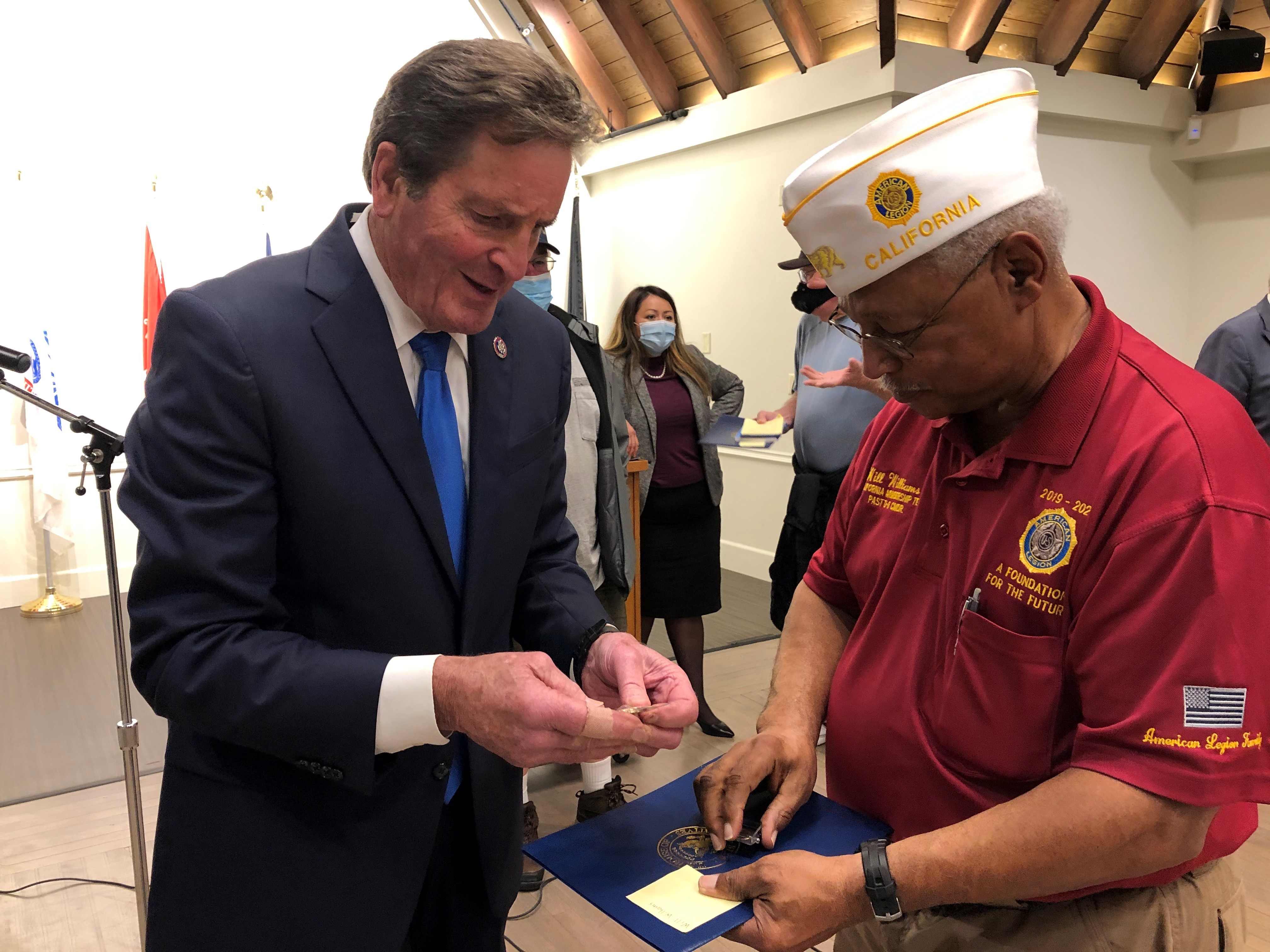 Garamendi presents a commendation and pin to a Vietnam veteran. 
